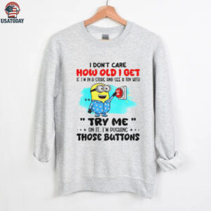 Minion red button I don’t care how old I get if I’m in a and see a toy with me try me on it I’m pushing the buttons shirt