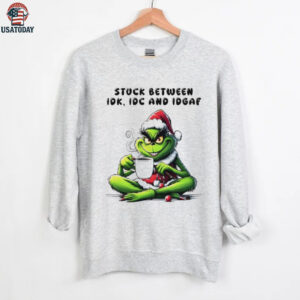 The Grinch drink coffee stuck between IDK IDC AND IDGAF Christmas 2025 shirt