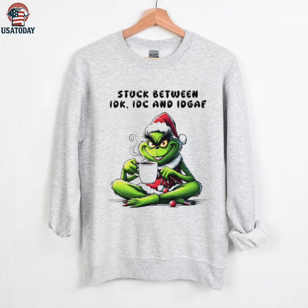 The Grinch drink coffee stuck between IDK IDC AND IDGAF Christmas 2025 shirt The Grinch drink coffee stuck between IDK IDC AND IDGAF Christmas 2025 shirt