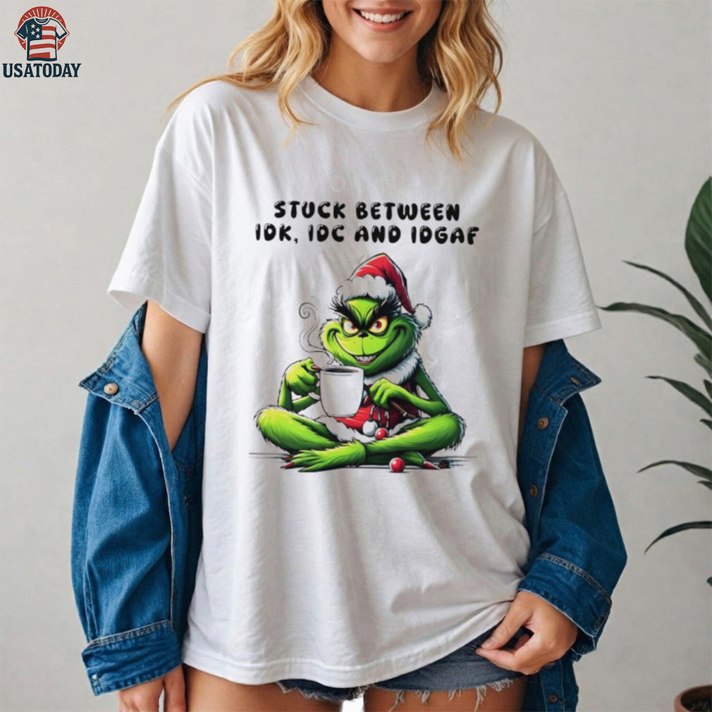 The Grinch drink coffee stuck between IDK IDC AND IDGAF Christmas 2025 shirt The Grinch drink coffee stuck between IDK IDC AND IDGAF Christmas 2025 shirt