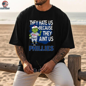 Custom Philadelphia Phillies Grinch Christmas Tee, Funny Santa Baseball Shirt with Quote They Hate Us Ain’t Us, MLB Fan Gift